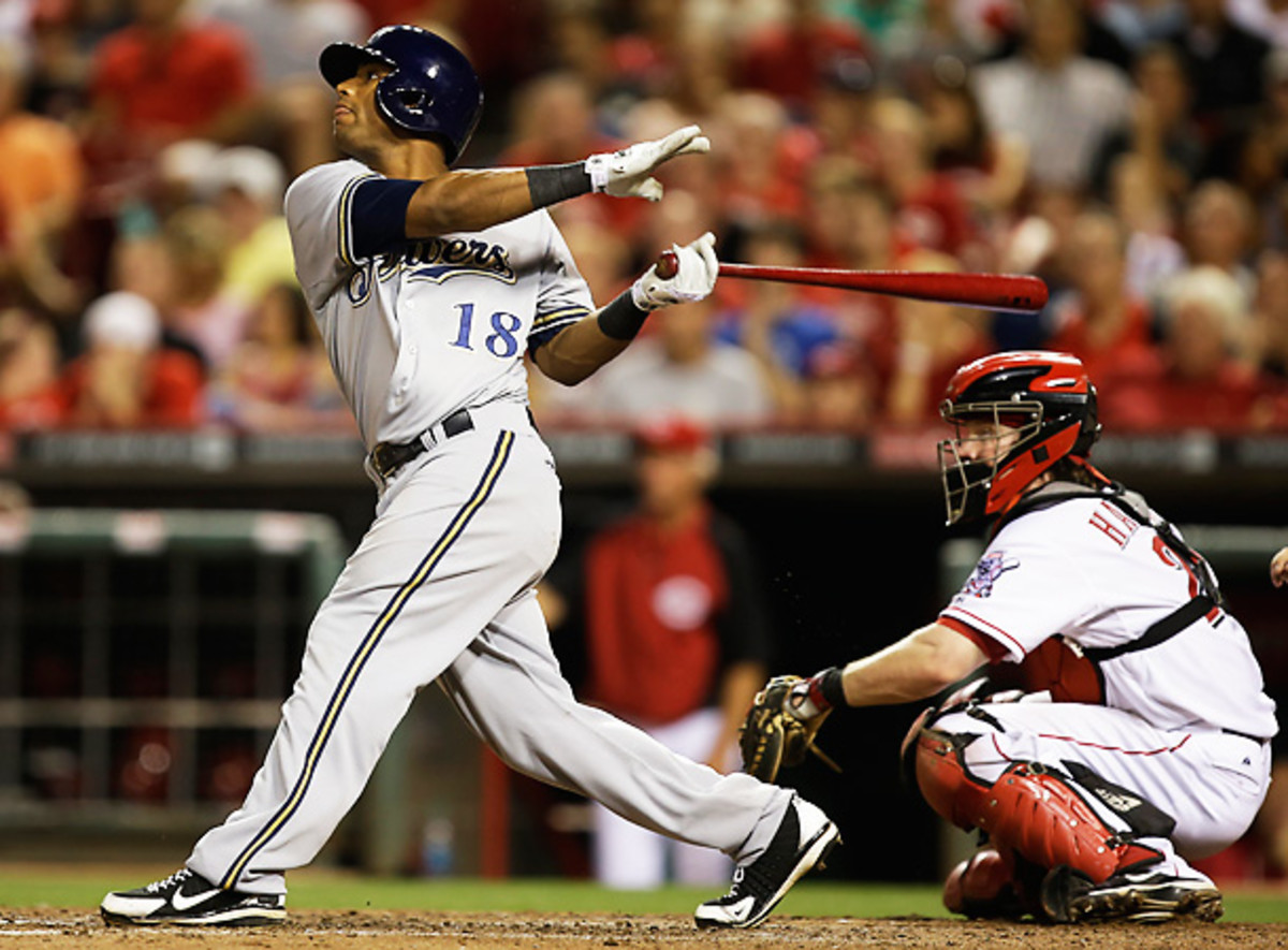 Khris Davis homered twice, including a go-ahead shot to lift the Brewers over the Reds. [Al Behrman/AP]