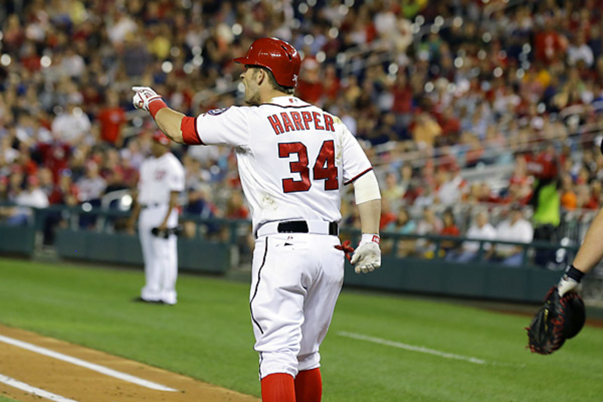 Harper was hit by Julio Teheran in the 5th after homering off him in the 3rd. (AP Photo/Alex Brandon)