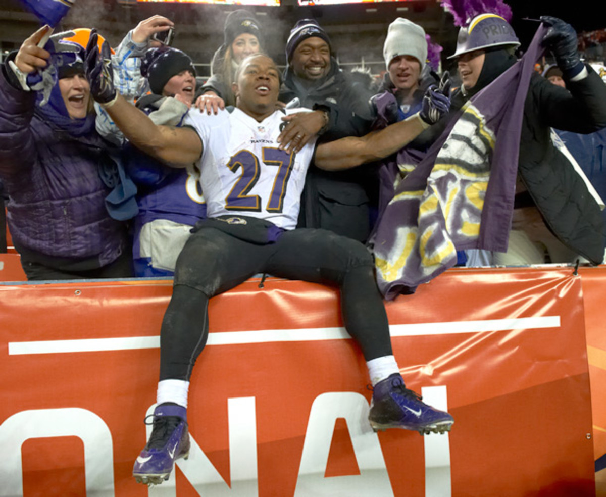 Ray Rice celebrates with the few Ravens fans who scored ticket to a playoff game against Denver earlier this month. (John Biever/SI)