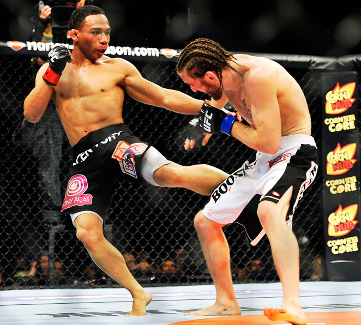 John Dodson kicks Timothy Elliott in a flyweight bout during UFC on Fox 3 at the Izod Center. Dodson won by unanimous decision in the third round. 