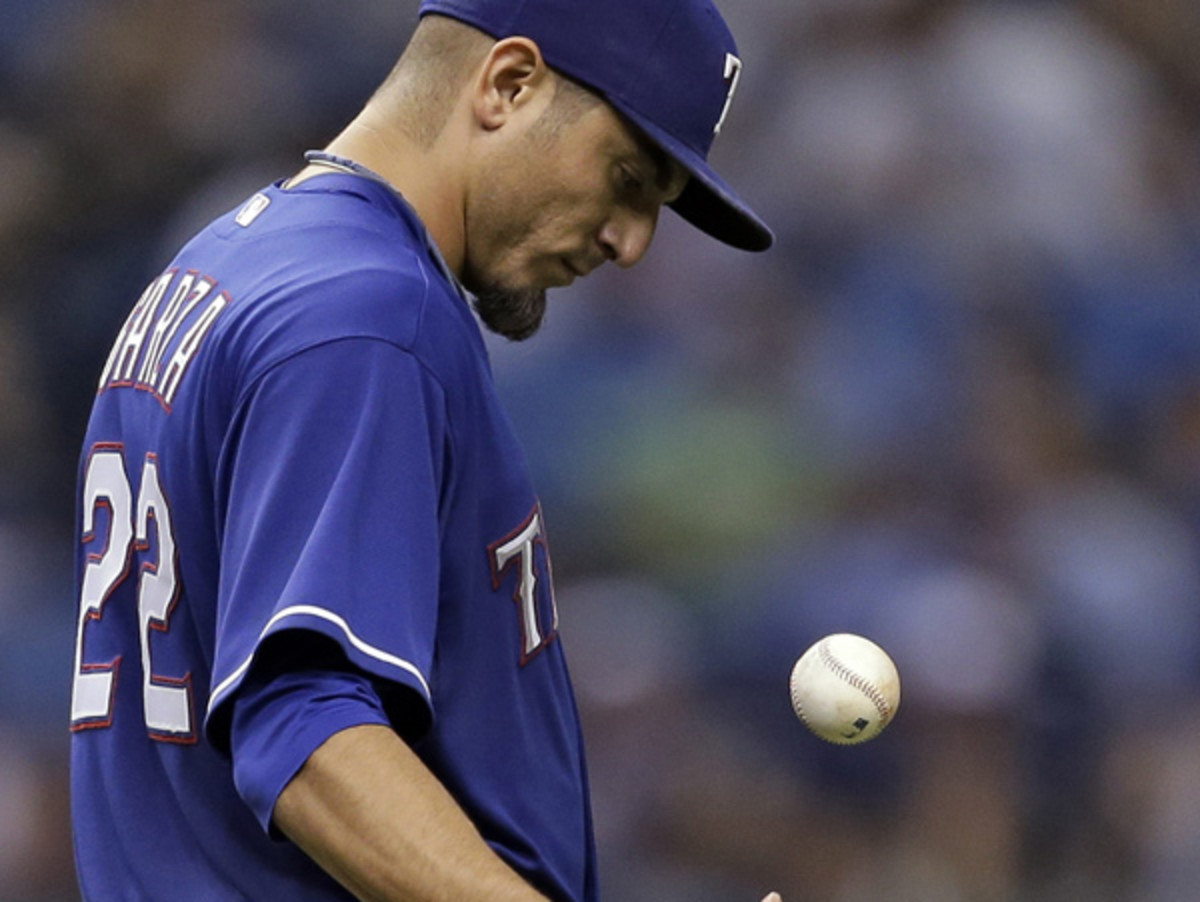 Matt Garza didn't make it out of the fifth inning in his start against Tampa on Monday (Chris O'Meara/AP)