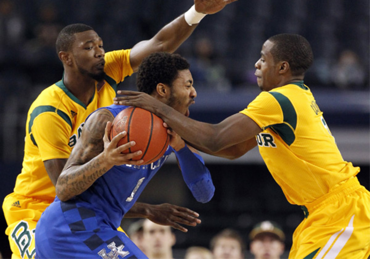 Kenny Cherry (right) finished with 18 points and five assists in win over Kentucky. (Tony Gutierrez/AP)