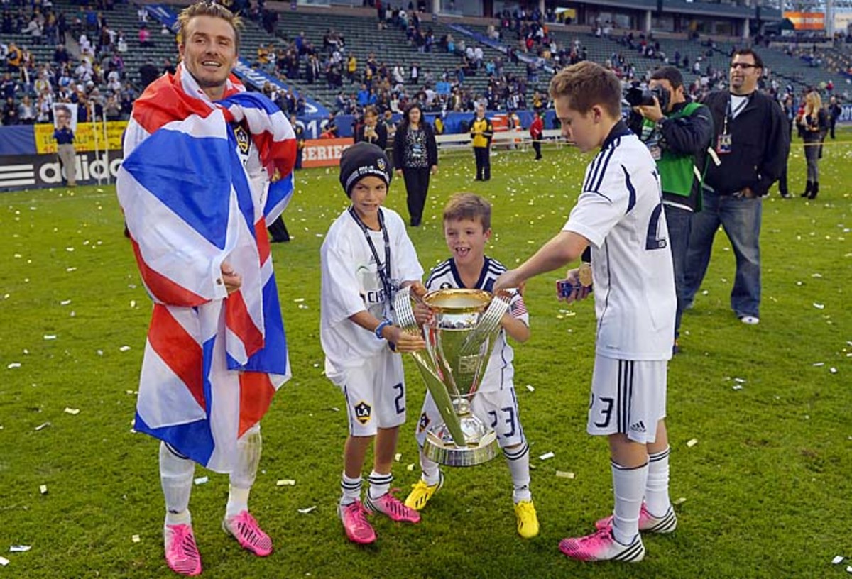 David Beckham celebrates an MLS Cup win with sons Romeo, second from left, Cruz, second from right, and Brooklyn.