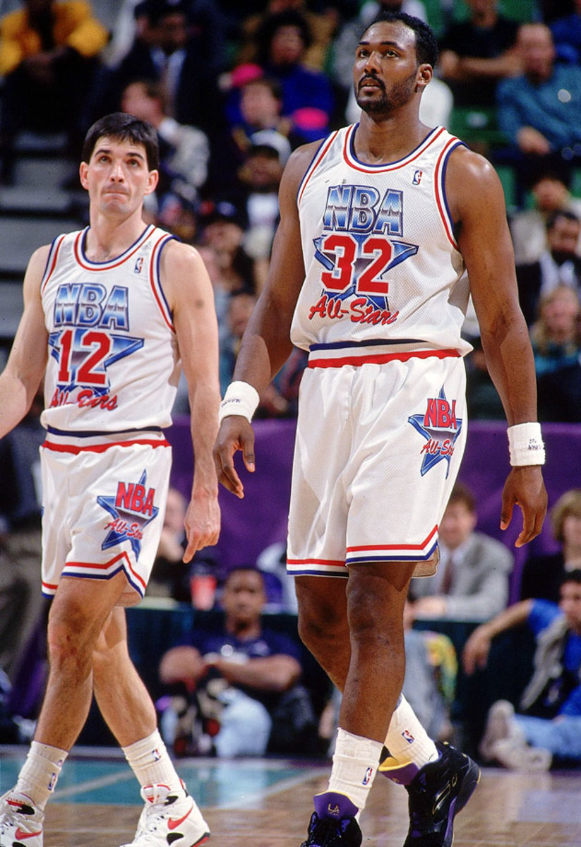 Retired power forward Karl Malone poses with John Stockton after