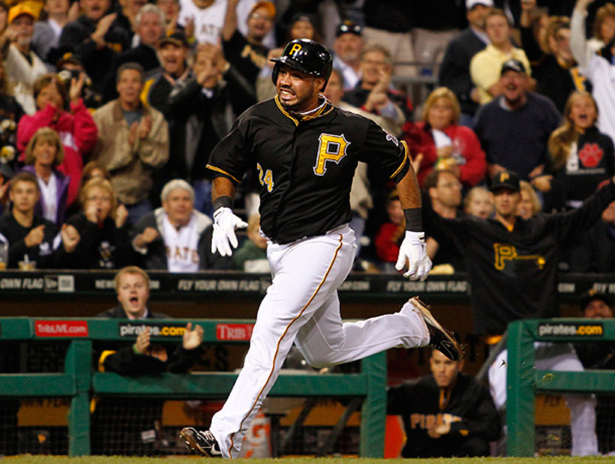 Pedro Alvarez had to hustle in order to seal his inside-the-park home run against the Cubs. (Justin K. Aller/Getty Images)