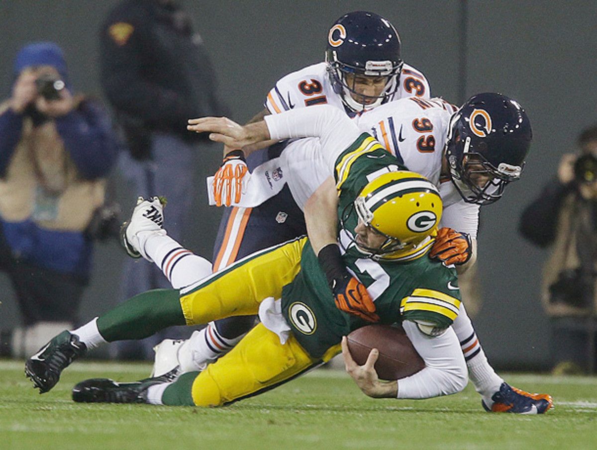 Aaron  Rodgers was injured when his left shoulder was driven into the turf. (Jeffrey Phelps/AP)