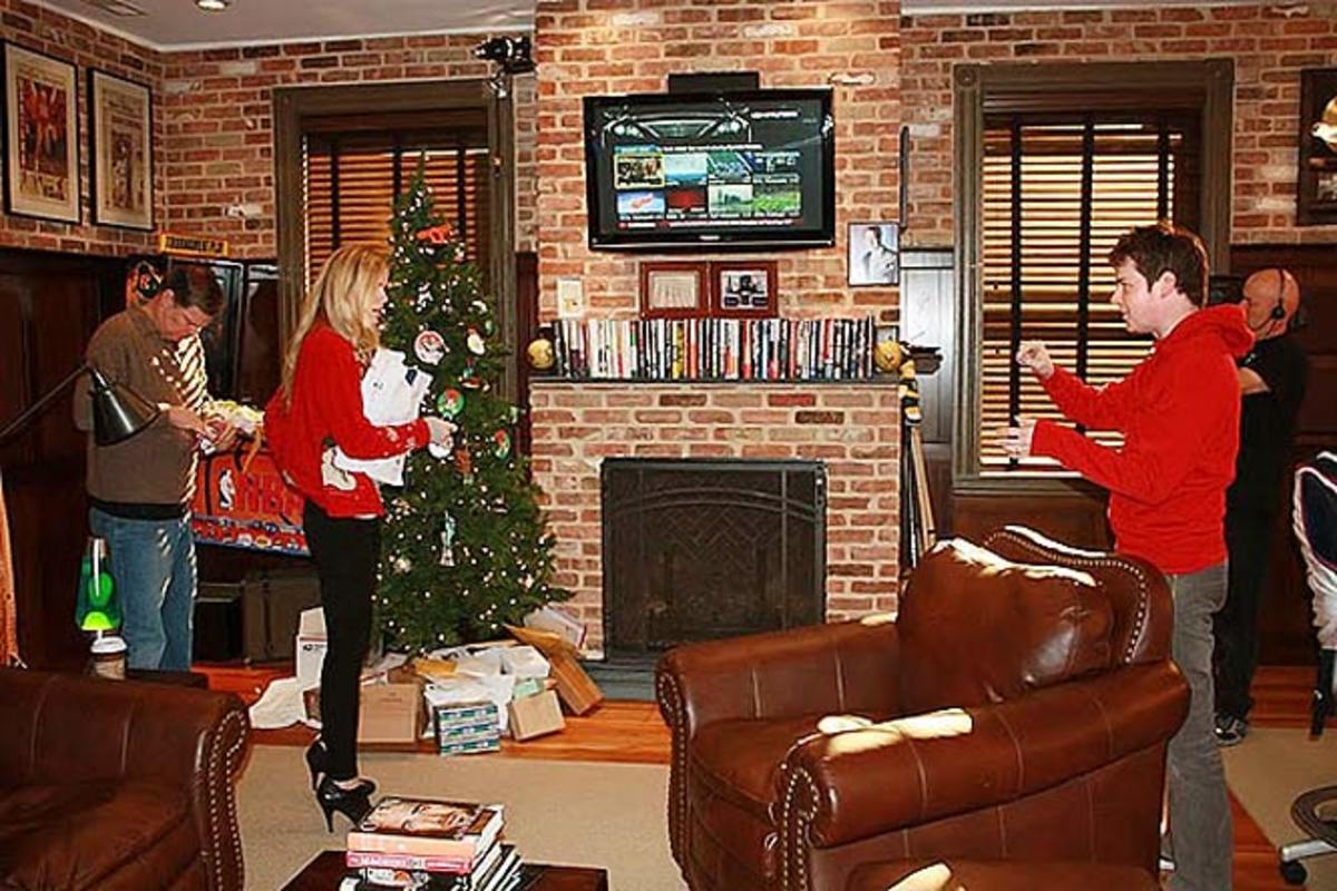 Dan, Seton and Brooklyn Decker decorate the Christmas Tree