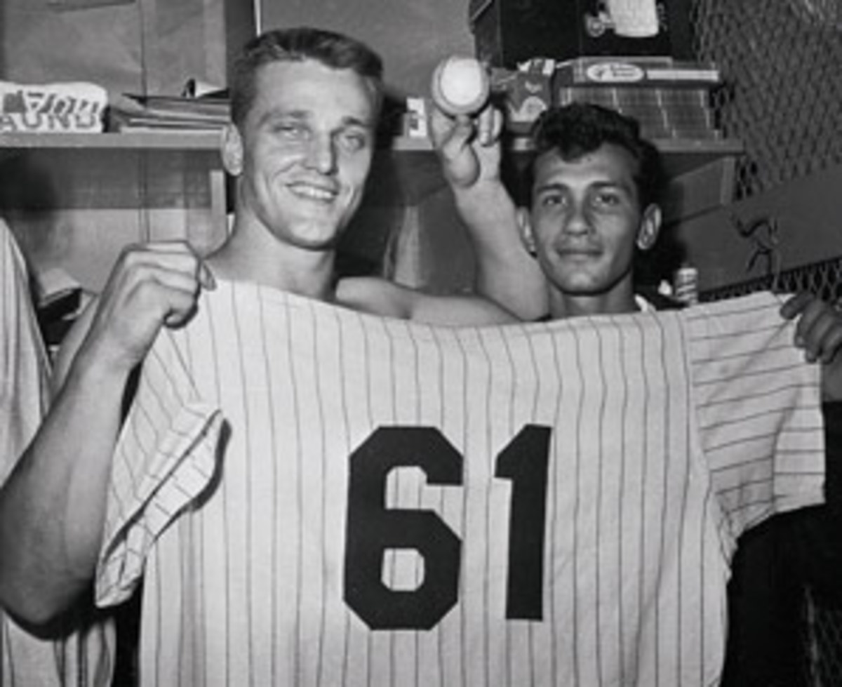 Roger Maris broke the home run record, with 61 in '61