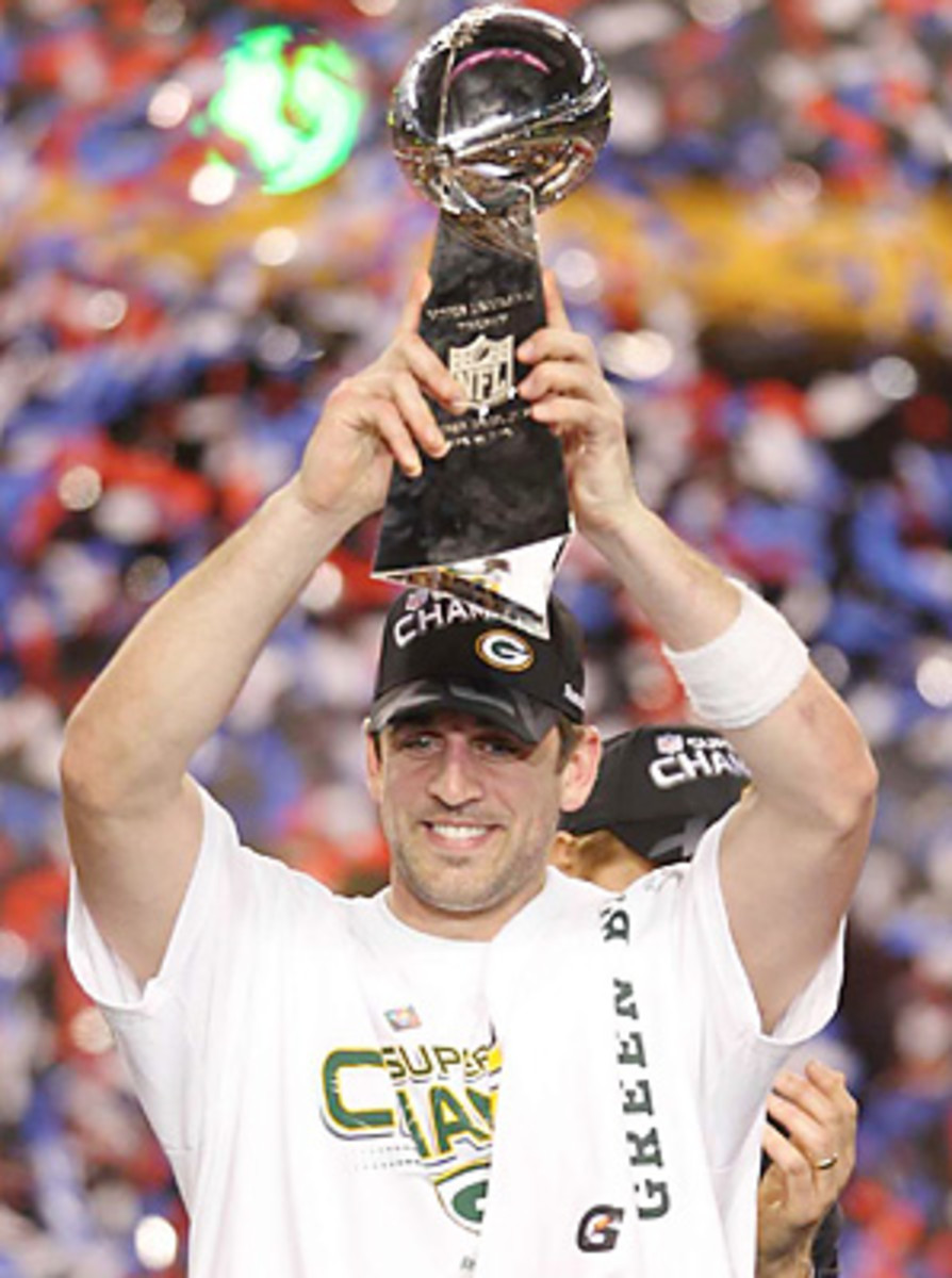 Aaron Rodgers holding Super Bowl trophy