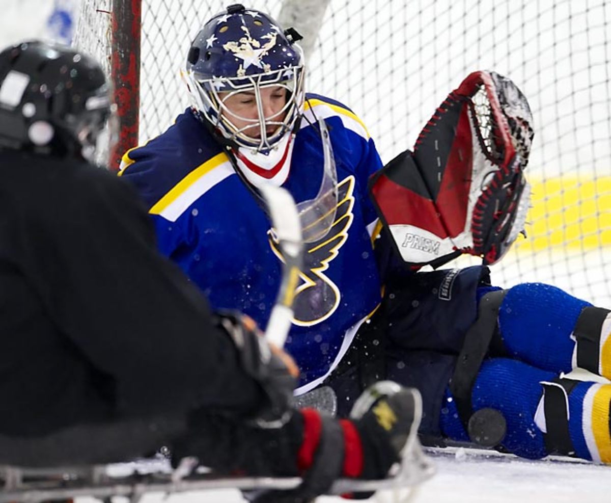  Scott Brandon makes a save against Kevin McKee