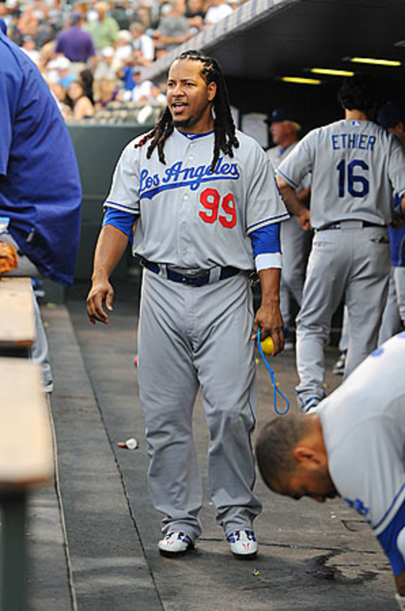 A fan holds up a jersey for Los Angeles Dodgers' Manny Ramirez