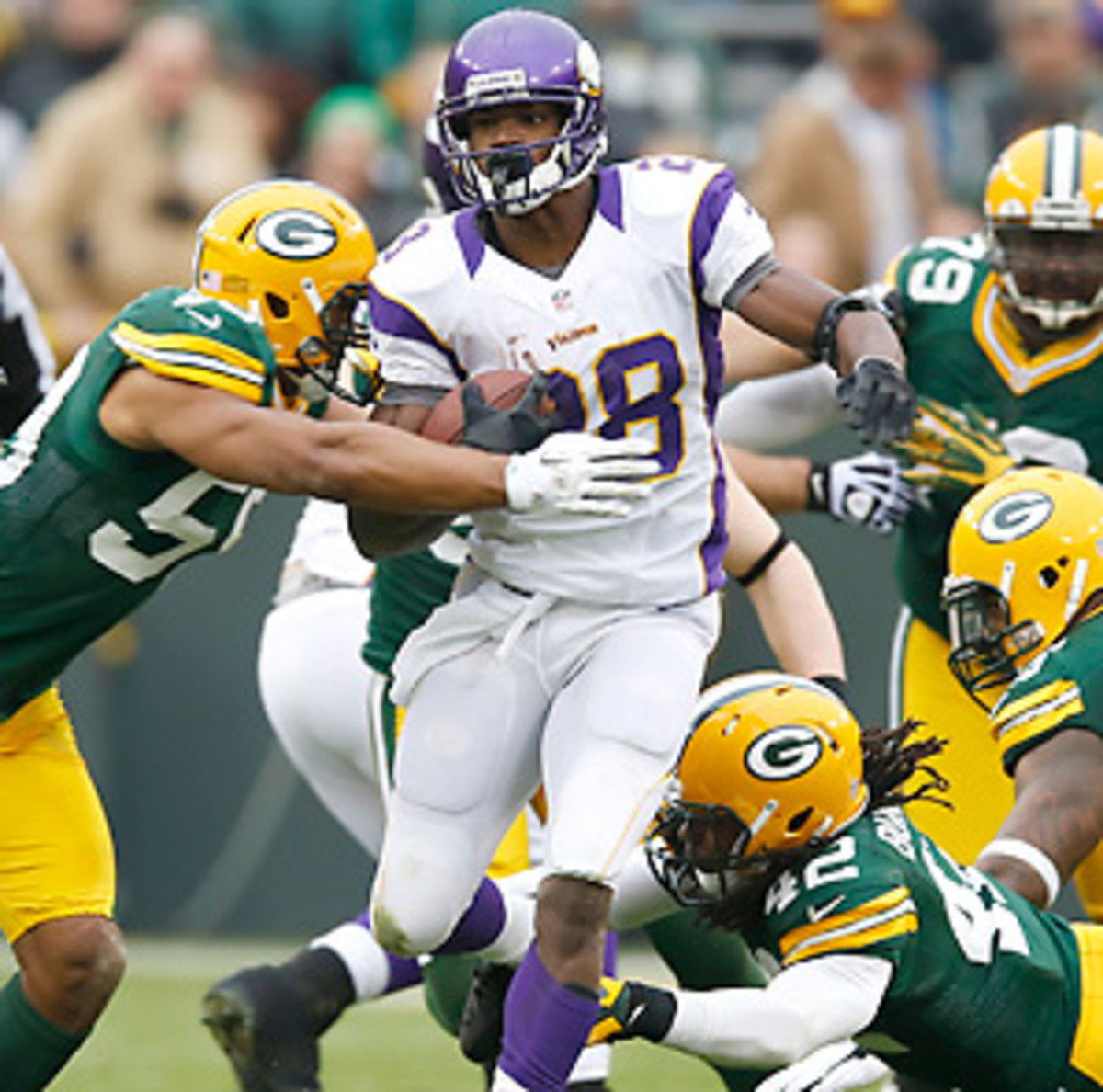 Adrian Peterson posted his sixth 100-yard game in a row against the Packers. (Tom Lynn/AP)