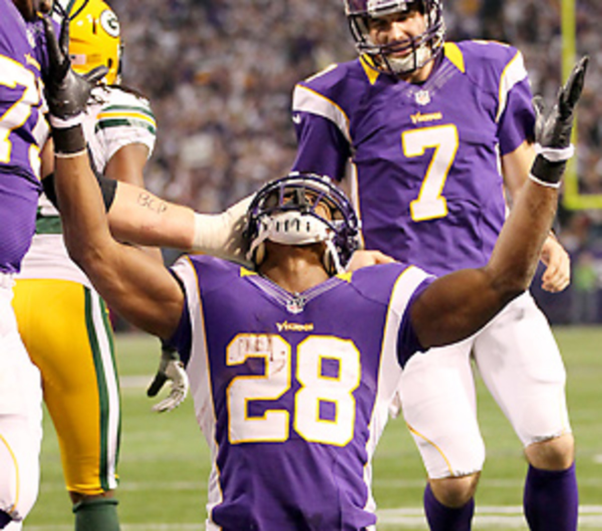 Adrian Peterson is a contender for MVP, Offensive Player of the Year and Comeback Player of the Year. (Andy Clayton King/Getty Images)