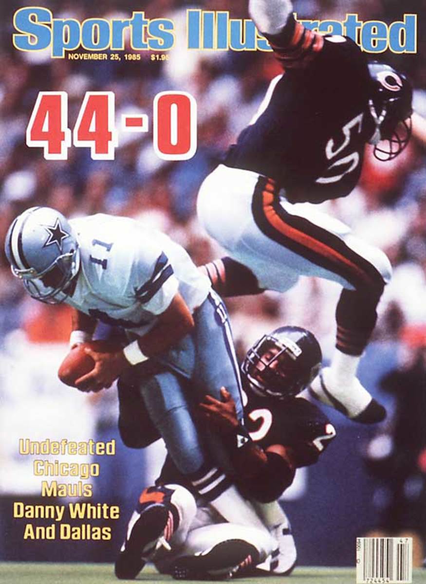 Chicago Bears' Richard Dent carries the Super Bowl Trophy as the 1985 Bears'  championship team is honored duing half time of an NFL football game  between the Chicago Bears and the Washington