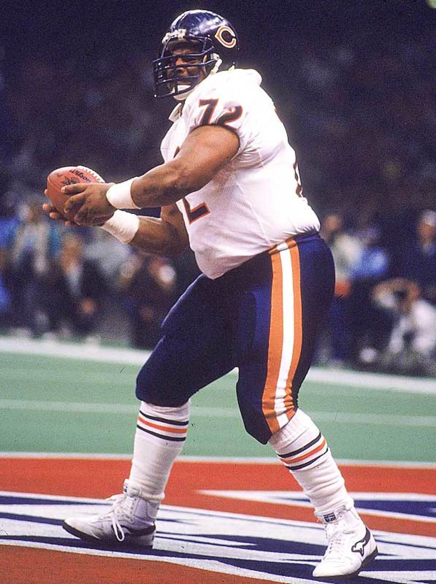 Chicago Bears' Richard Dent carries the Super Bowl Trophy as the 1985 Bears'  championship team is honored duing half time of an NFL football game  between the Chicago Bears and the Washington