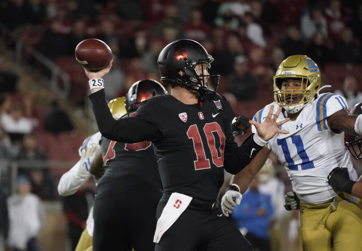 Oct 17, 2019; Stanford, CA, USA; Stanford Cardinal quarterback Jack West (10) throws a pass under pressure from UCLA Bruins linebacker Keisean Lucier-South (11) in the third quarter at Stanford Stadium. UCLA defeated Stanford 34-16. Lee-USA TODAY Sports