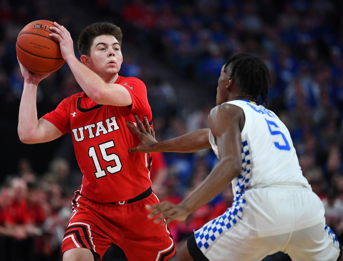 Dec 18, 2019; Las Vegas, NV, USA; Utah Utes guard Rylan Jones (15) looks to pass the ball against Kentucky Wildcats guard Immanuel Quickley (5) during the first half at T-Mobile Arena.