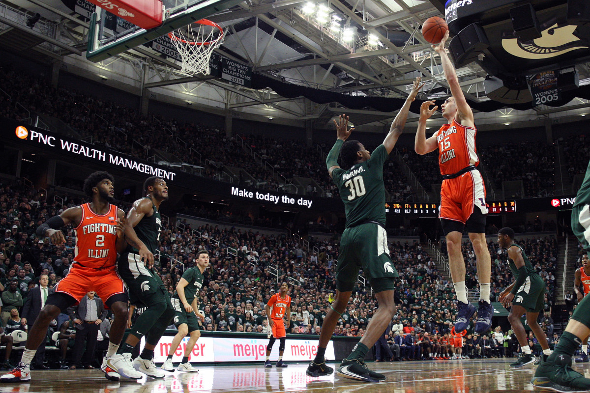 Illinois Fighting Illini forward Giorgi Bezhanishvili (15) shoots over Michigan State Spartans forward Marcus Bingham Jr. (30) during the first half of a game at the Breslin Center.