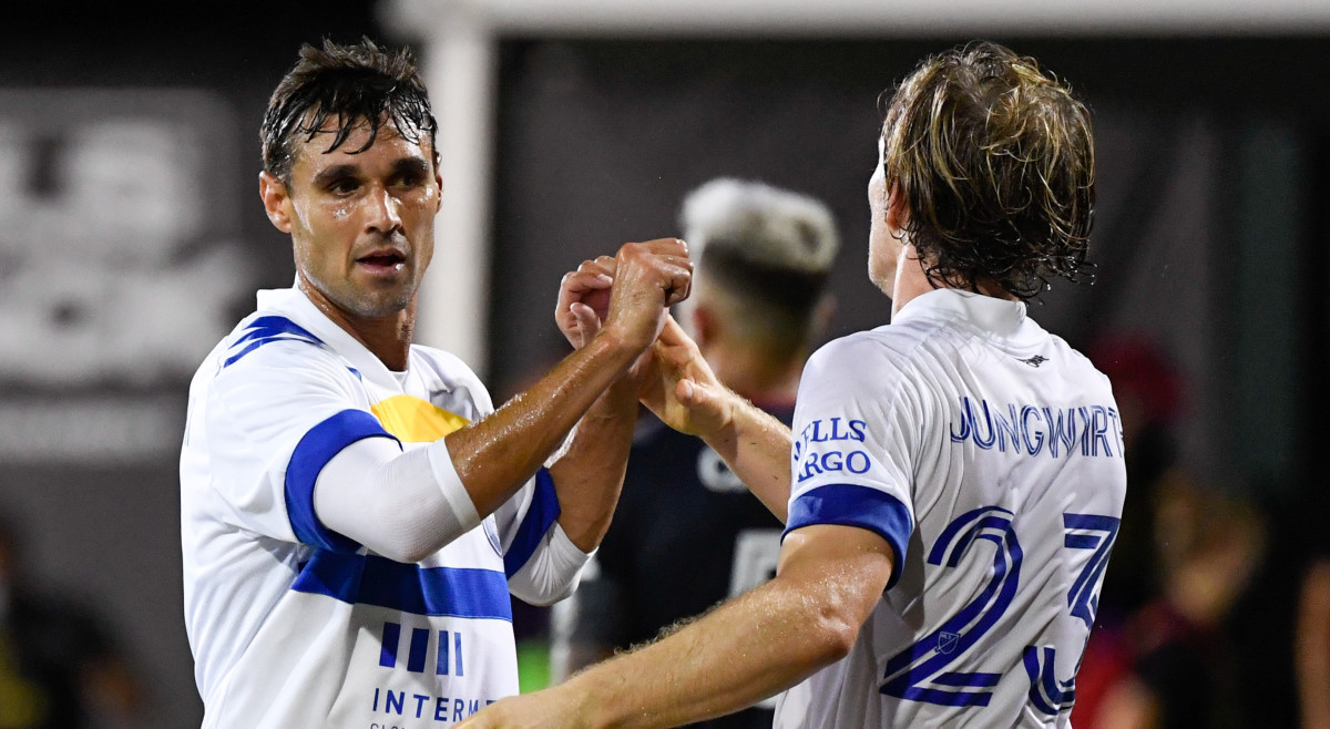 San Jose Earthquakes forward Chris Wondolowski (8) celebrates with midfielder Florian Jungwirth (23) after defeating the Chicago Fire during the first half at ESPN Wide World of Sports.