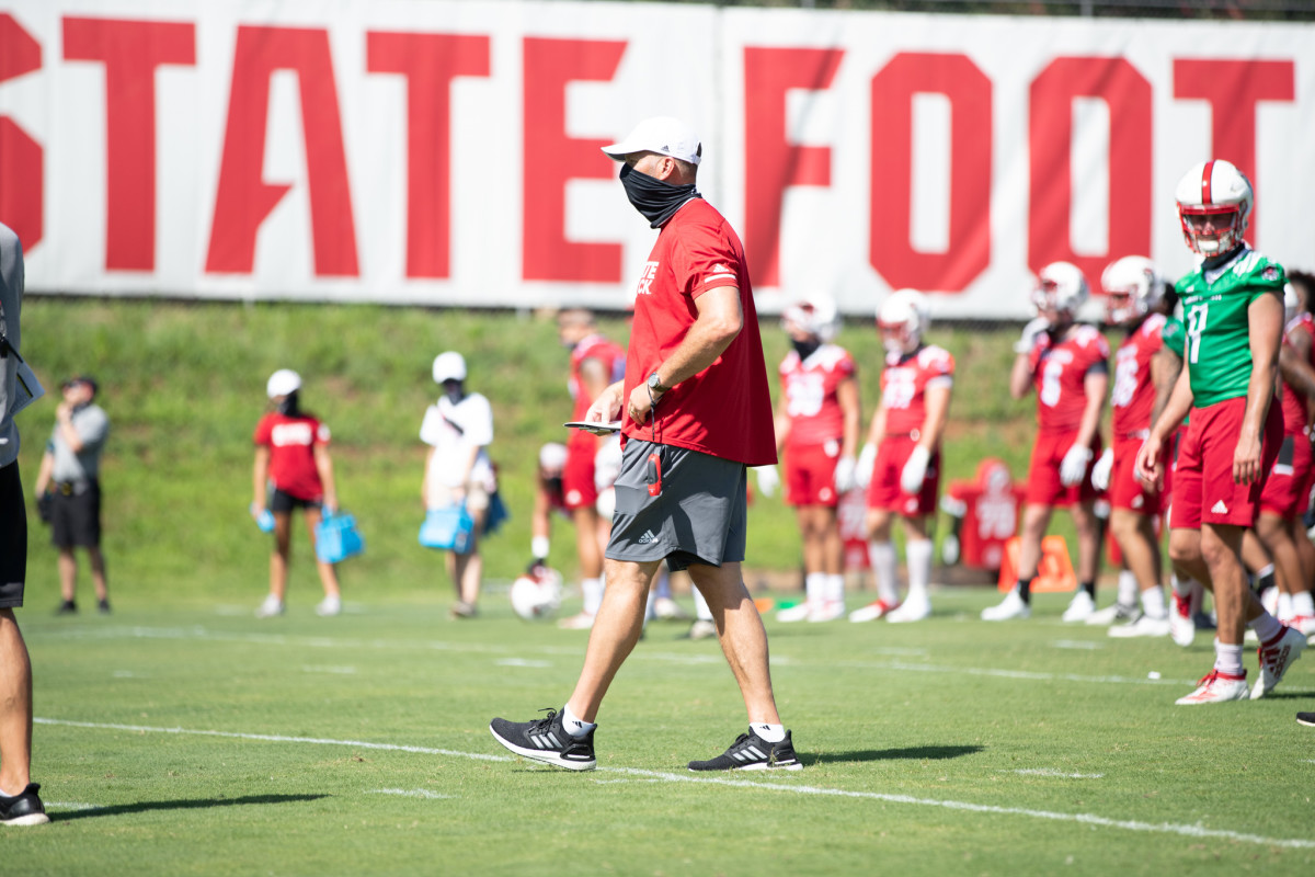 NC State coach Dave Doeren wears a mask during a recent Wolfpack practice