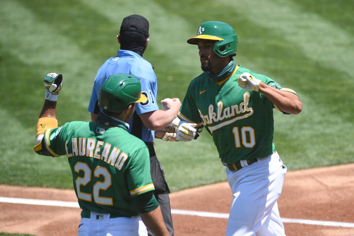 A's Marcus Semien (side) feels 'a little better,' swinging a bat