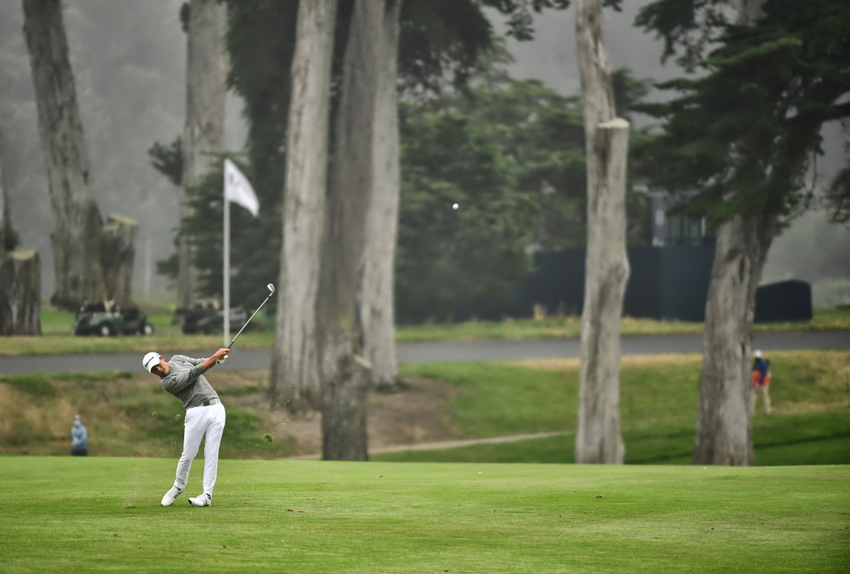 Collin Morikawa hits an apporach shot at the 2020 PGA Championship golf tournament at TPC Harding Park.