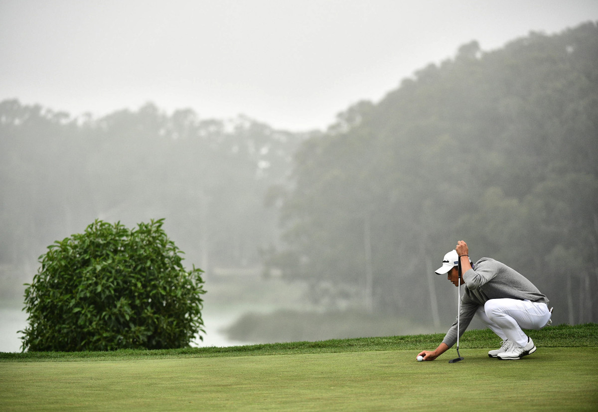 Collin Morikawa sets up a putt at the 2020 PGA Championship