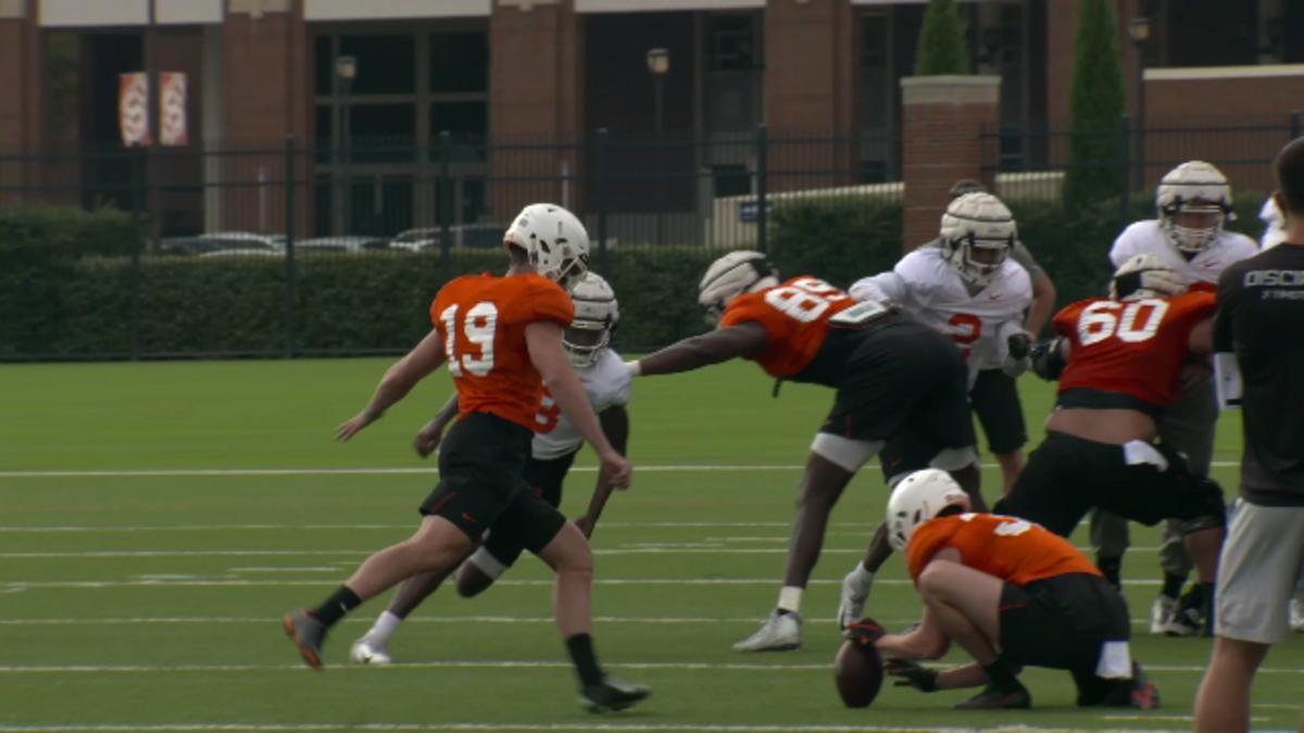 Alex Hale kicking during a special teams period. 