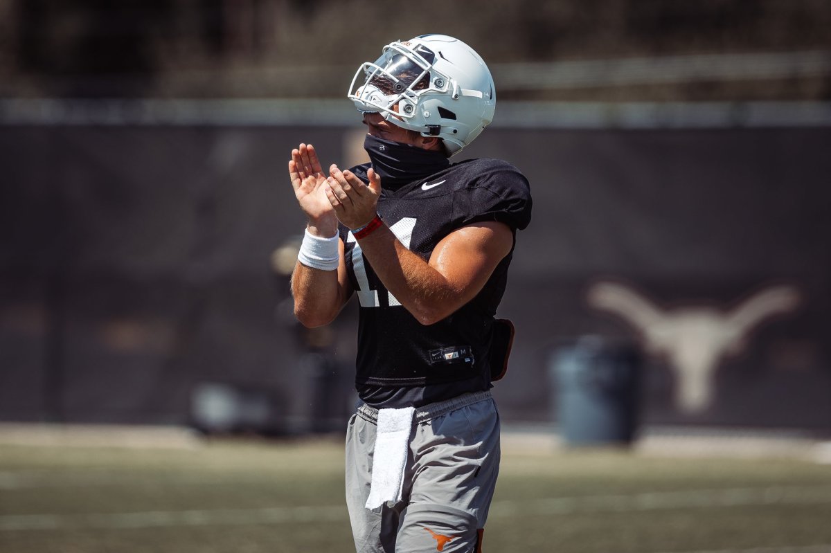 Sam Ehlinger wearing face mask during practice