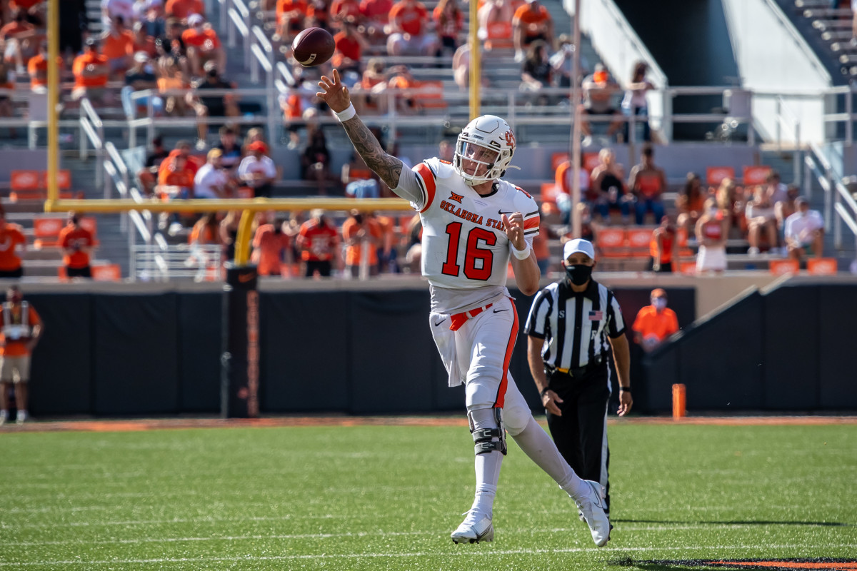 Fans can be seen spaced out throughout Boone Pickens Stadium at the last home game with West Virginia.