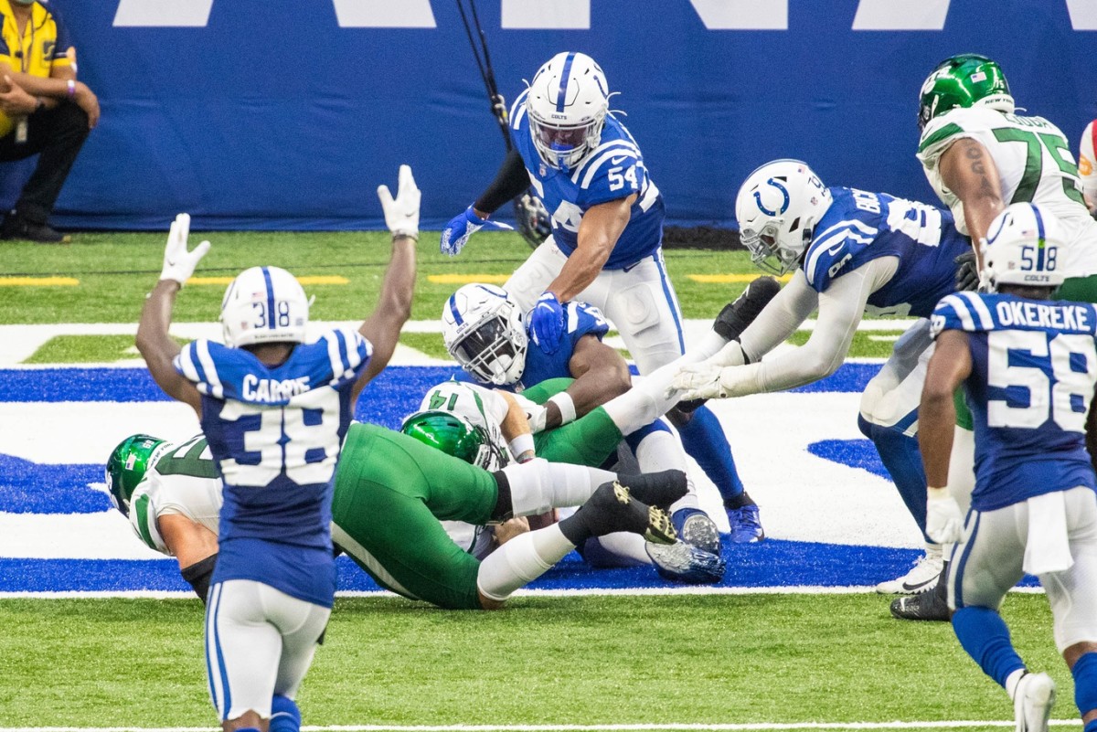 Indianapolis Colts defensive end Justin Houston tackles New York Jets quarterback Sam Darnold for a safety in Sunday's 36-7 home win at Lucas Oil Stadium.