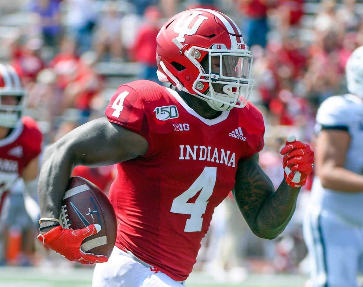 Indiana Hoosiers linebacker Cam Jones (4) returns an interception during the game against UConn at Memorial Stadium in Bloomington, Ind., on Saturday, Sept. 21, 2019.