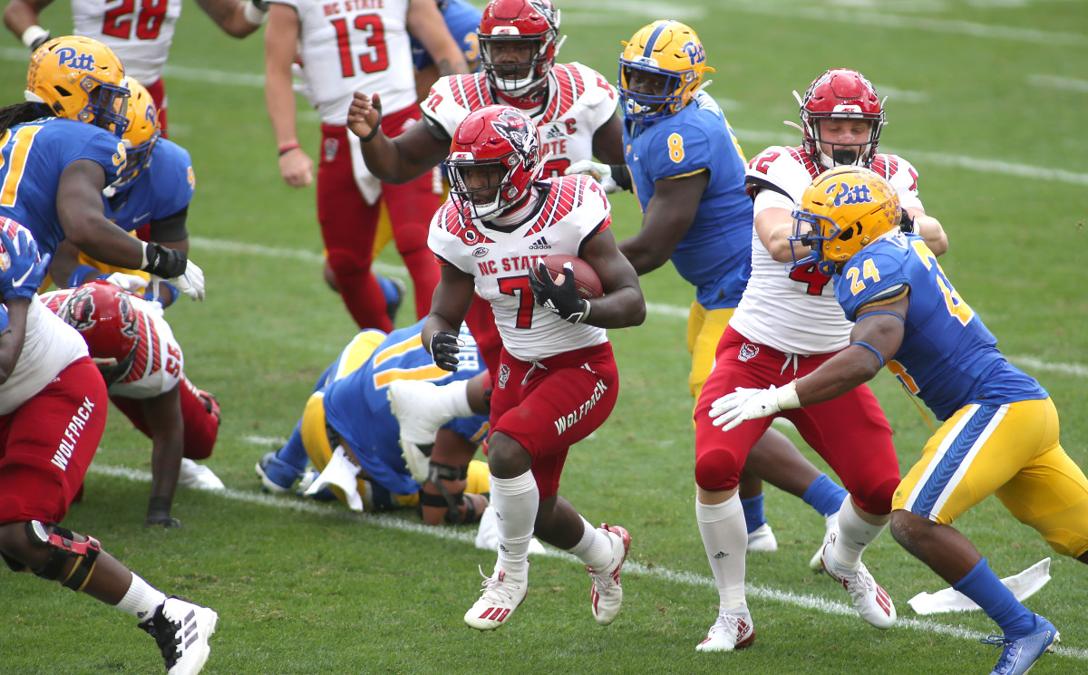 Tight end Dylan Autenreith opens up a hole for running back Zonovan Knight