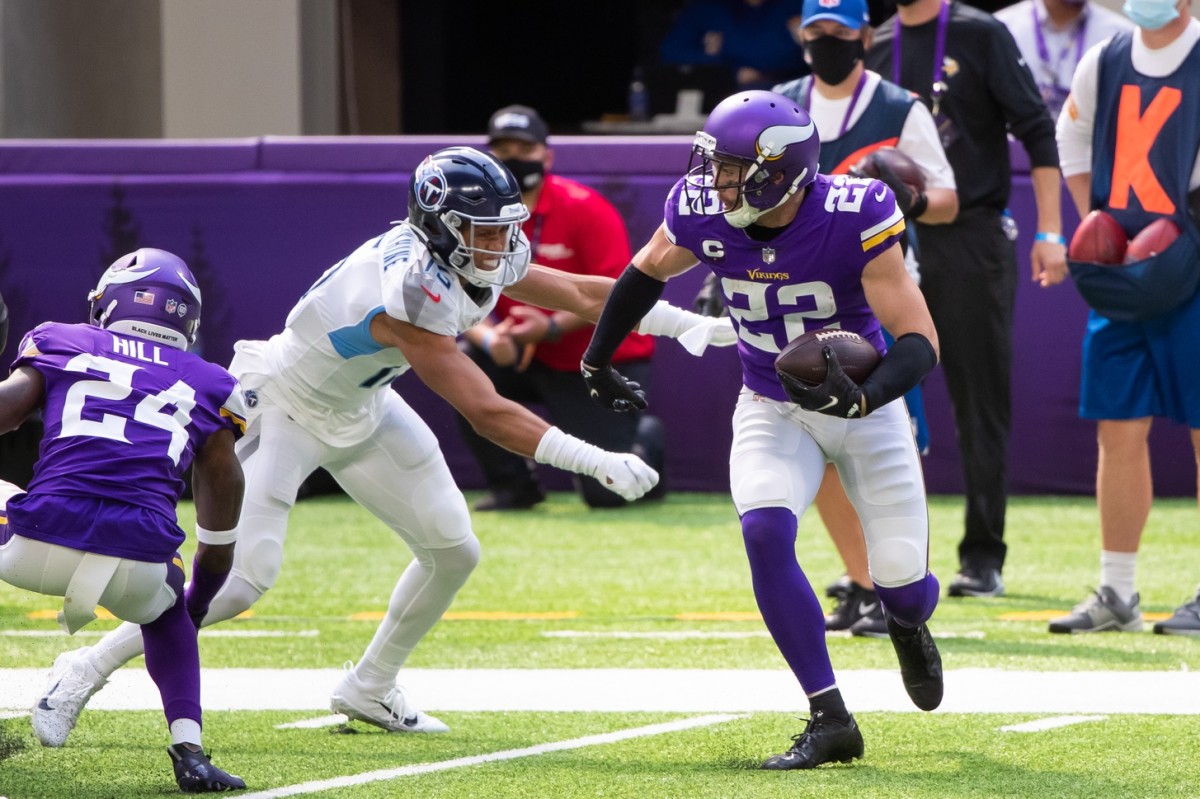 Minnesota Vikings safety Harrison Smith (22) tries to stop New York Jets  wide receiver Garrett Wilson (17) during the second half of an NFL football  game Sunday, Dec. 4, 2022 in Minneapolis. (