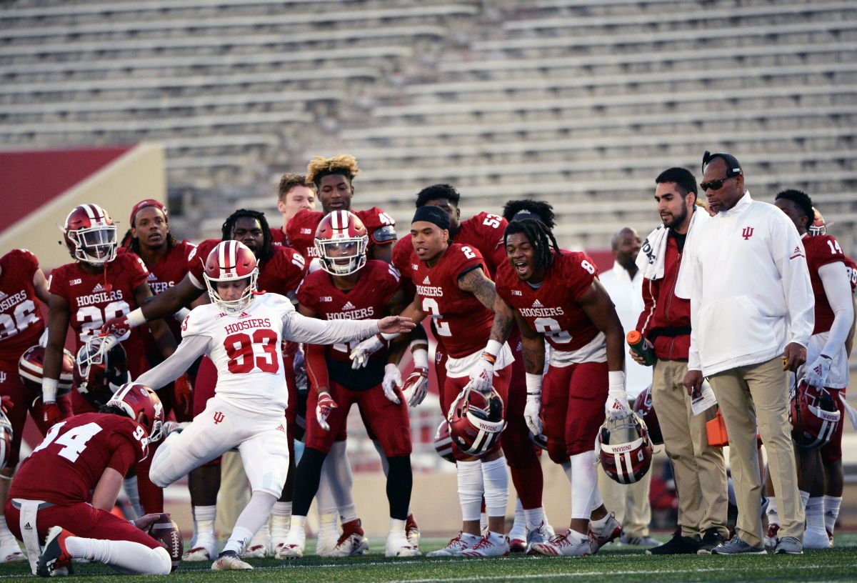 The defense tries the distract Indiana Hoosiers kicker Charles Campbell (93) during the Cream-Crimson spring game at Memorial Stadium in Bloomington, Ind., on Friday, April 12, 2019.