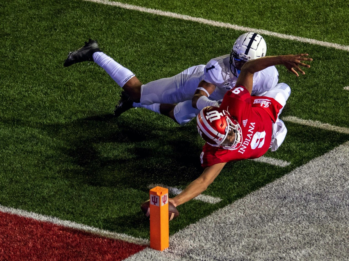 Indiana Hoosiers quarterback Michael Penix Jr. (9) dives with the ball to score a two point conversion and win the game in overtime during the game at Memorial Stadium. The Indiana Hoosiers defeated t...