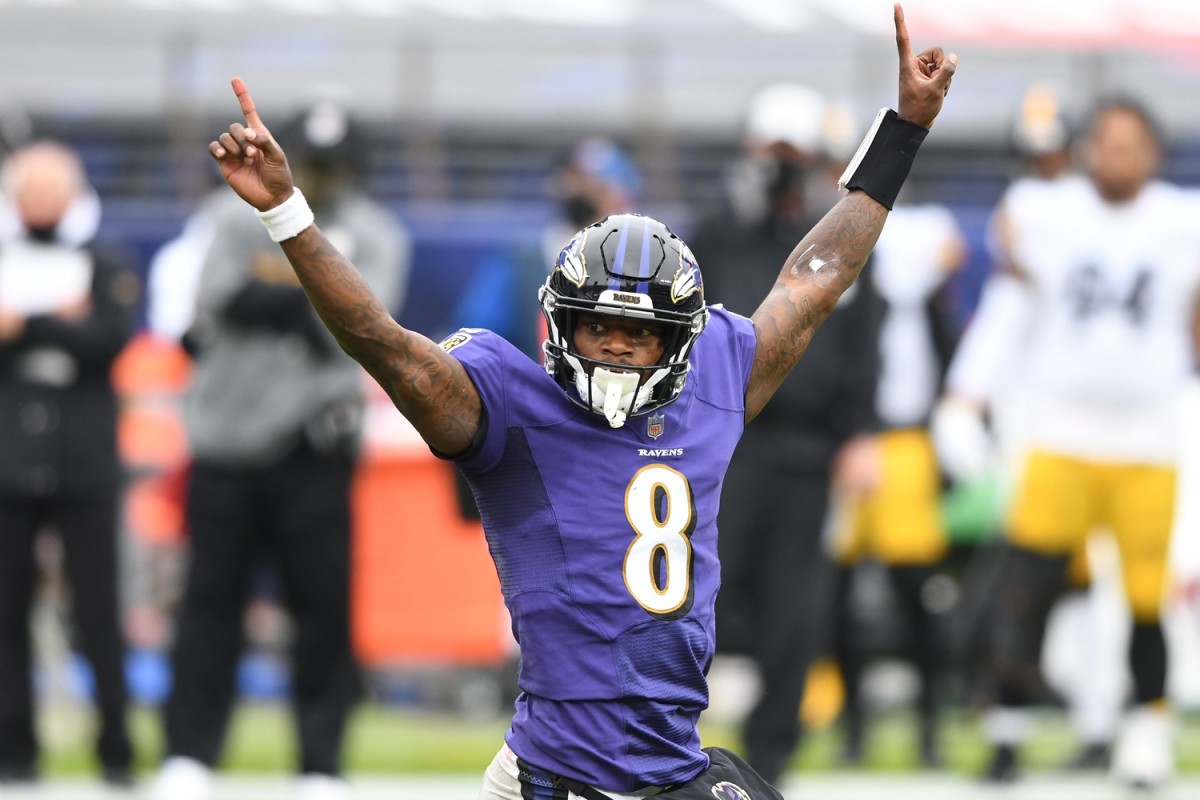 Quarterback Lamar Jackson of the Baltimore Ravens celebrates his