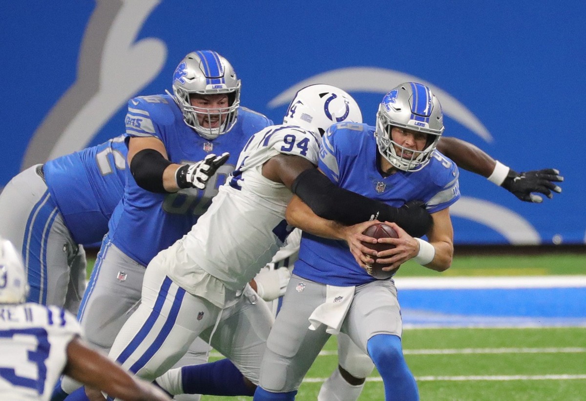 Indianapolis Colts defensive end/tackle Tyquan Lewis tackles Detroit Lions quarterback Matthew Stafford for one of the defender's two sacks in Sunday's road win at Ford Field.