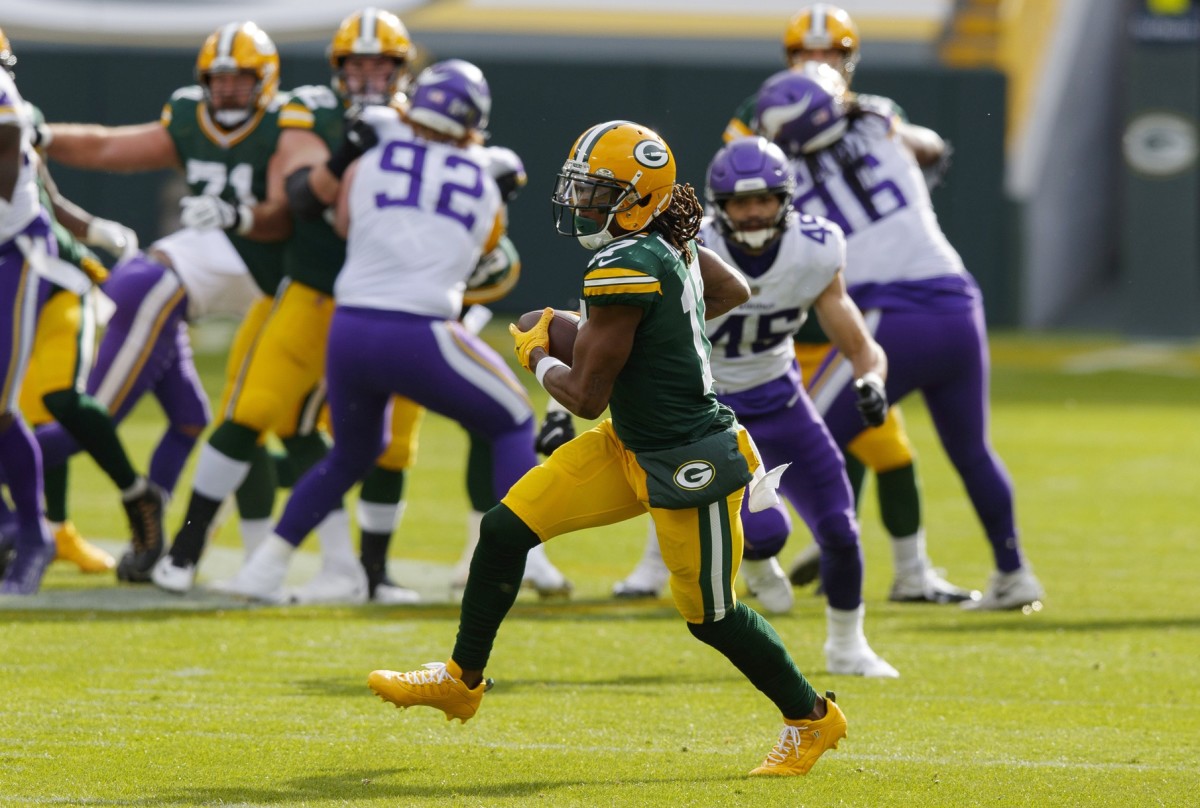 Green Bay wide receiver Davante Adams looks for yards after a catch against Minnesota.