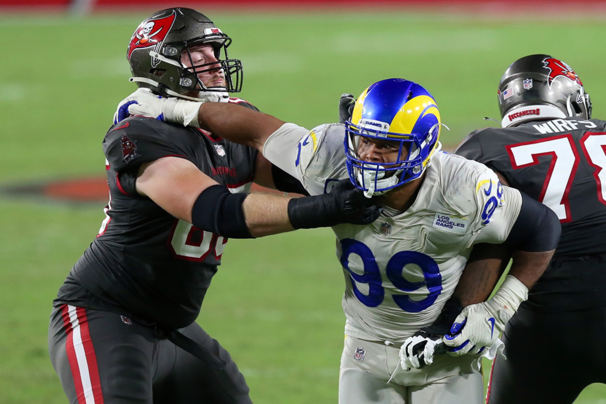 Watch: L.A. Rams' DT, linebacker tackle protester and the Manning