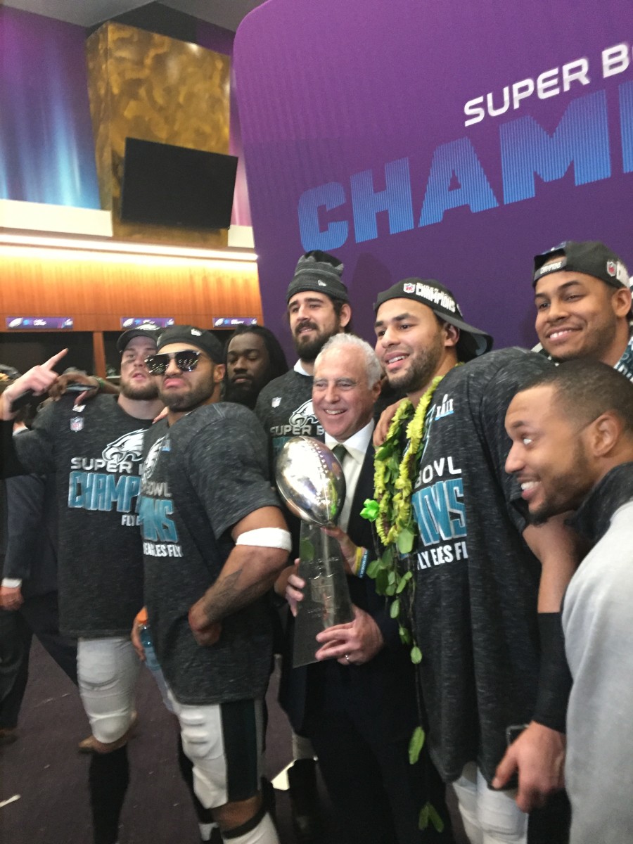 Eagles players surround owner Jeffrey Lurie after Super Bowl LII victory