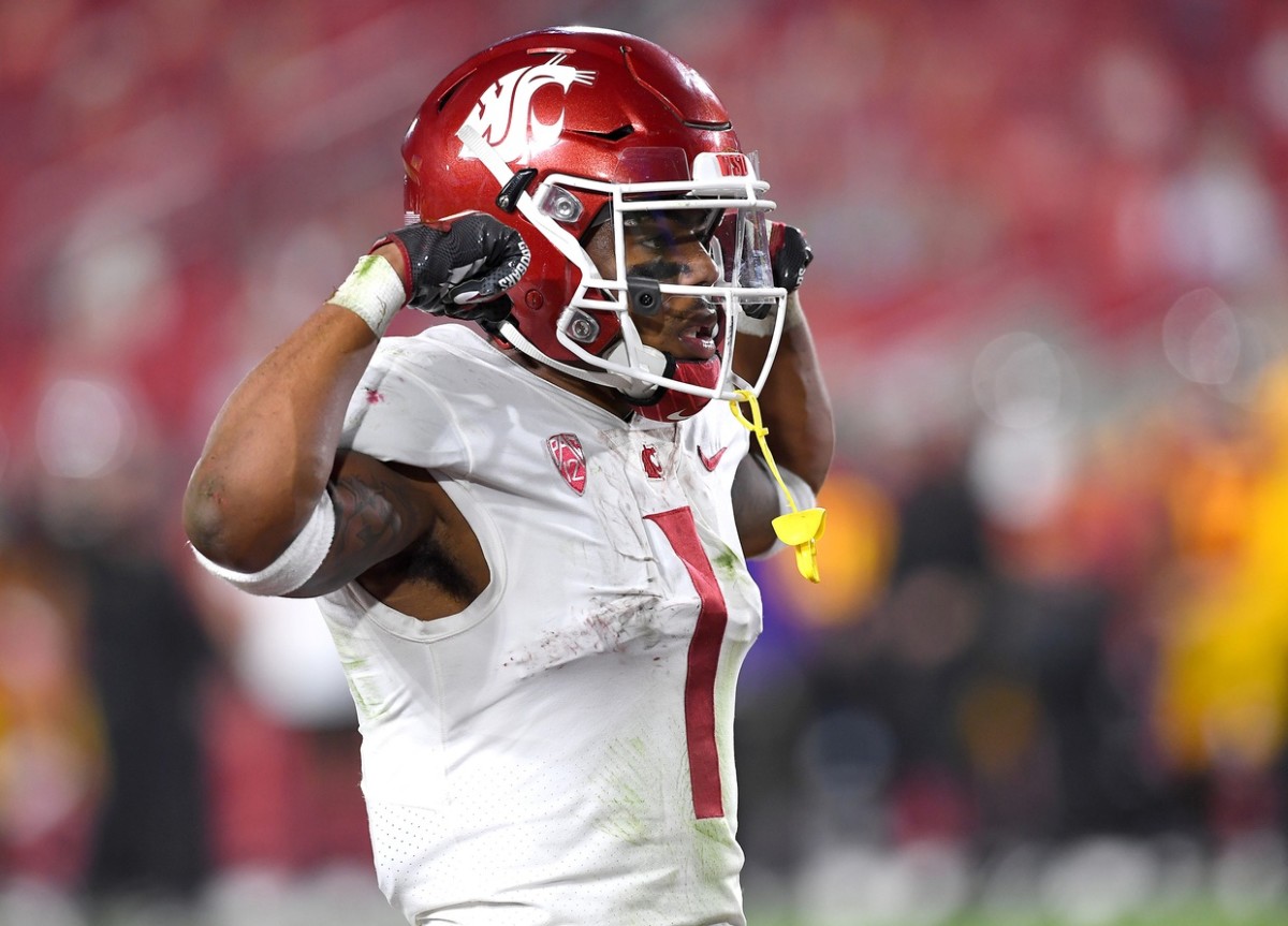 Dec 6, 2020; Los Angeles, California, USA; Washington State Cougars running back Deon McIntosh (3) celebrates after scoring a touchdown in the first half of the game against the USC Trojans at United Airlines Field at the Los Angeles Memorial Coliseum.