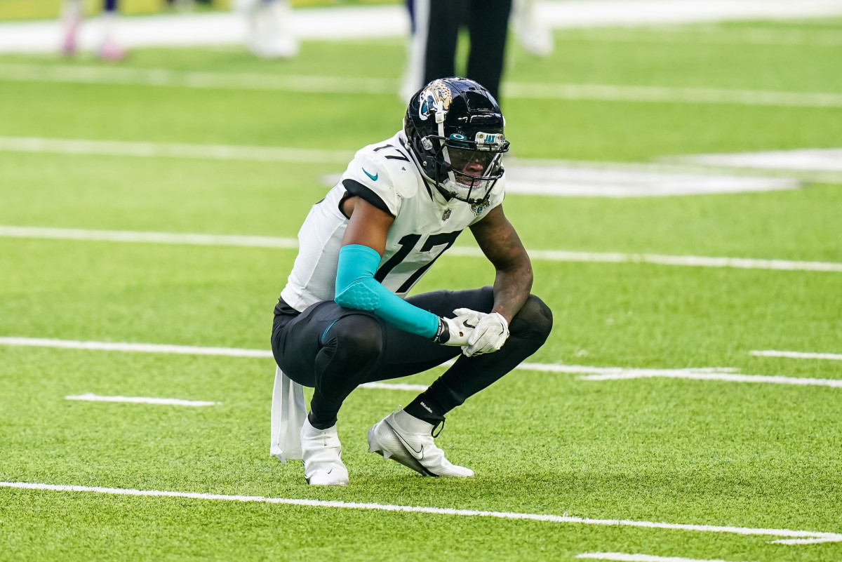 Jacksonville Jaguars wide receiver D.J. Chark (17) autographs his jersey on  the field after an NFL football game against the Tennessee Titans Sunday,  Sept. 23, 2018, in Jacksonville, Fla. The Titans won