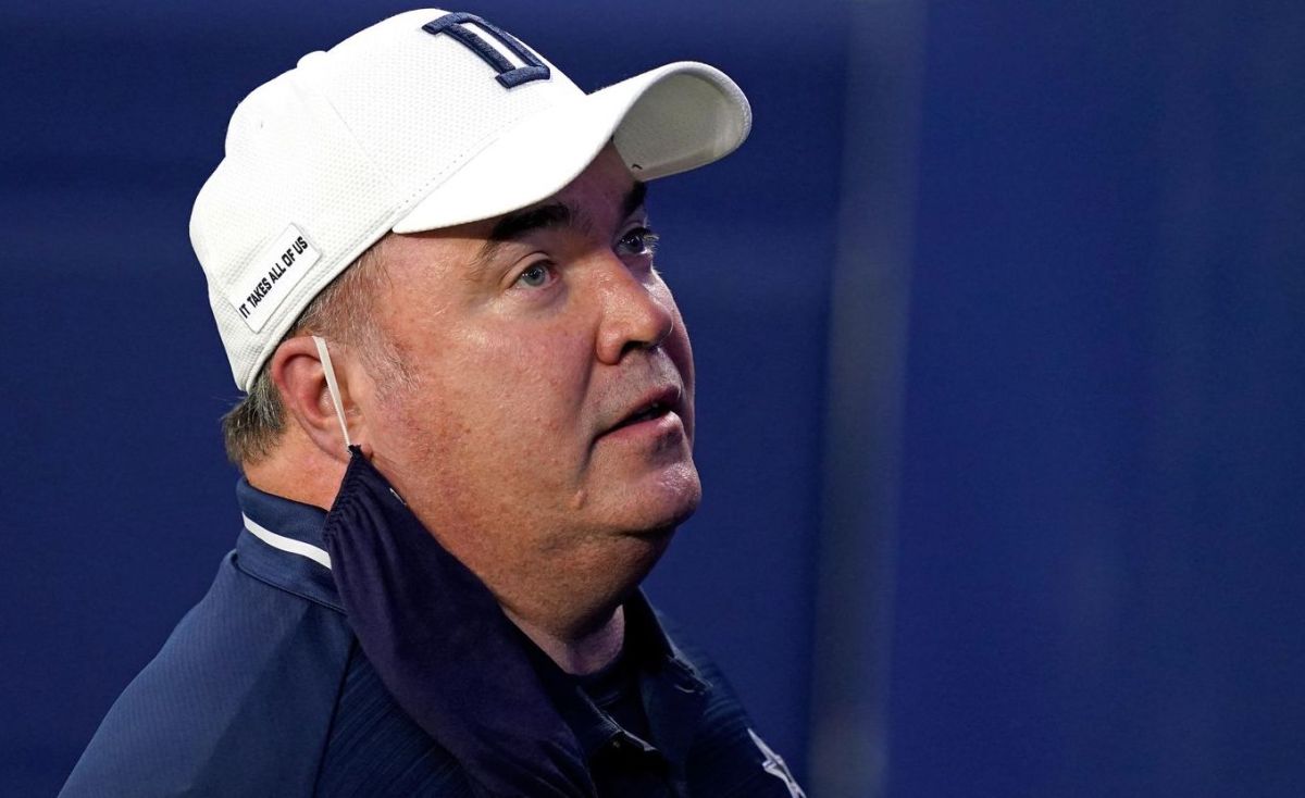 Dallas Cowboys head coach Mike McCarthy talks with line judge Mark