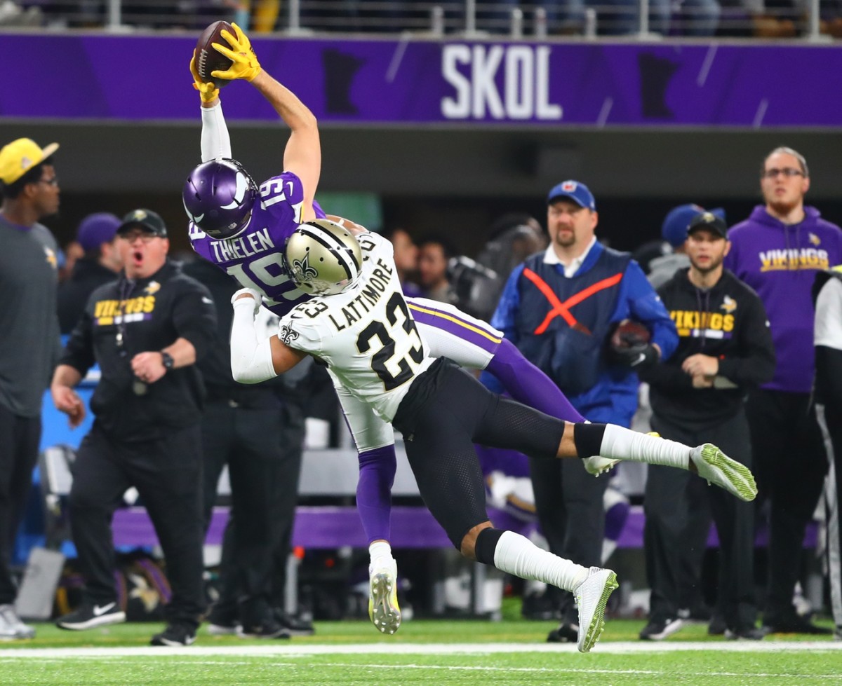 Jan 14, 2018; Minneapolis, MN, USA; Minnesota Vikings wide receiver Adam Thielen (19) catches a pass against New Orleans Saints cornerback Marshon Lattimore (23) in the fourth quarter at U.S. Bank Stadium. Mandatory Credit: Mark J. Rebilas-USA TODAY 