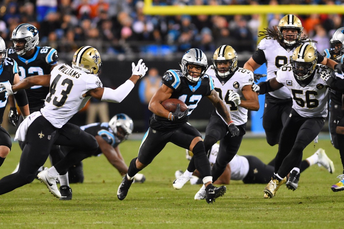 Carolina Panthers wide receiver D.J. Moore (12) takes a Kyle Allen pass 20  yards foe a touchdown against the New Orleans Saints at the Mercedes-Benz  Superdome in New Orleans December 30, 2018.