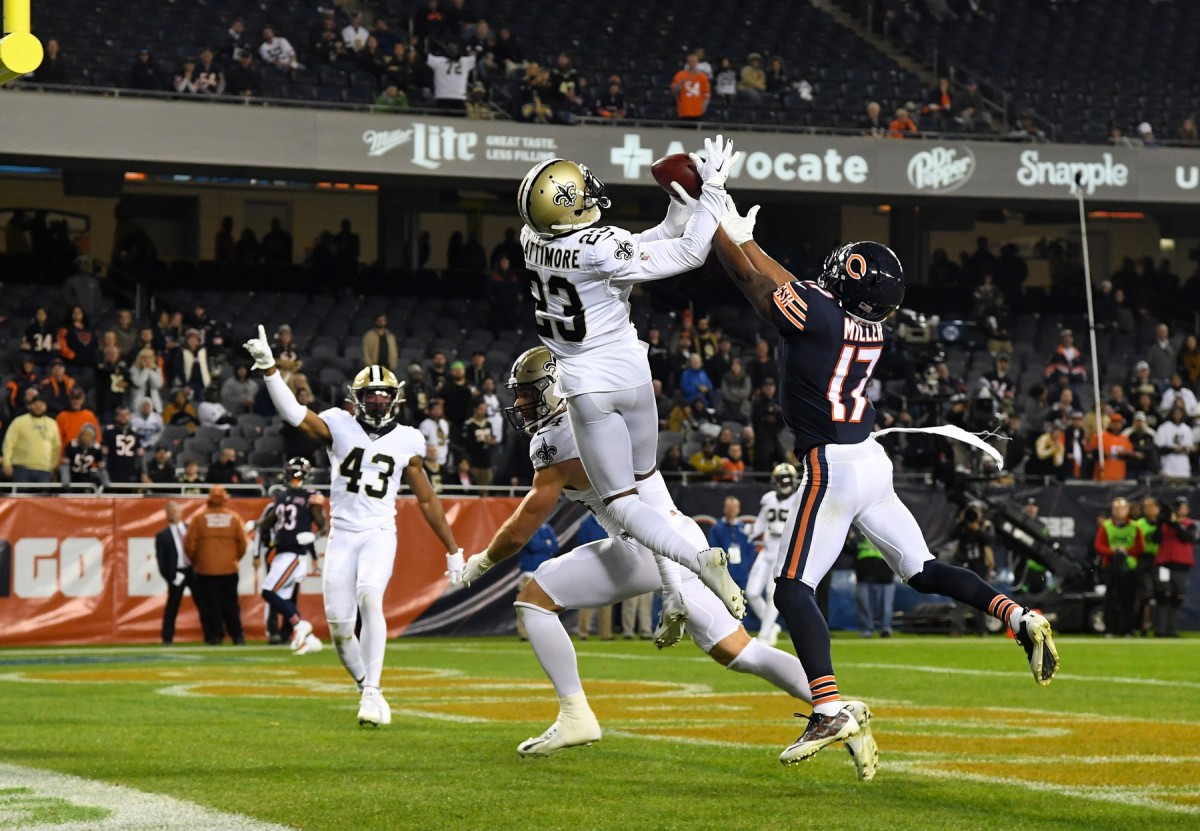 Oct 20, 2019; Chicago, IL, USA; New Orleans Saints cornerback Marshon Lattimore (23) and Chicago Bears wide receiver Anthony Miller (17) attempt to make a play on the ball during the second half at Soldier Field. Mandatory Credit: Mike DiNovo-USA TODAY Sports