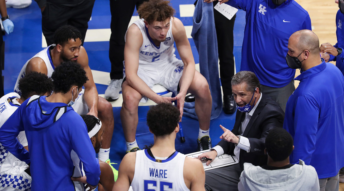 Kentucky men’s basketball team, John Calipari, kneeling for the anthem