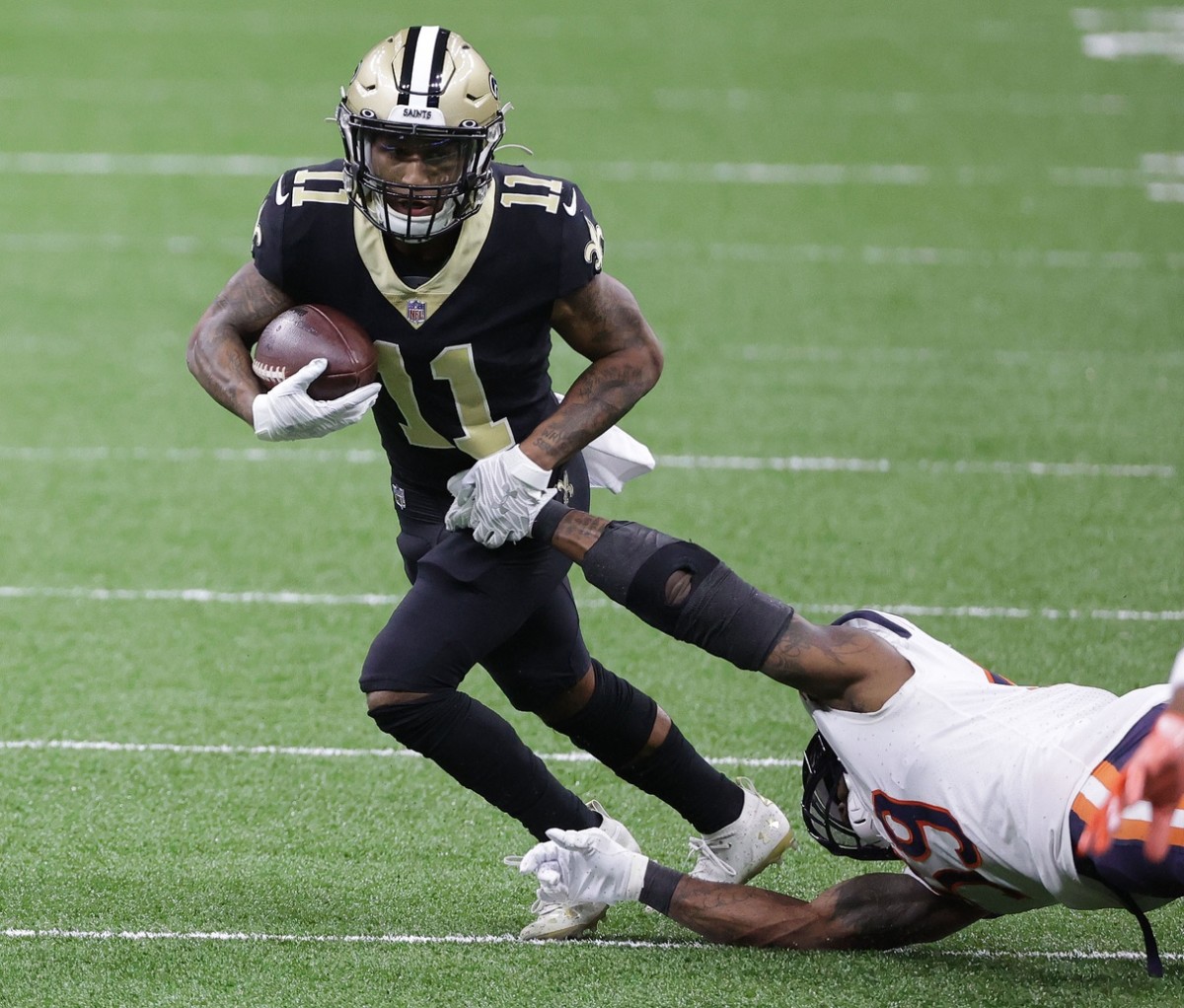 New Orleans Saints wide receiver Deonte Harris (11) returns a kickoff in  the first half of an NFL football game against the Carolina Panthers in New  Orleans, Sunday, Jan. 2, 2022. (AP