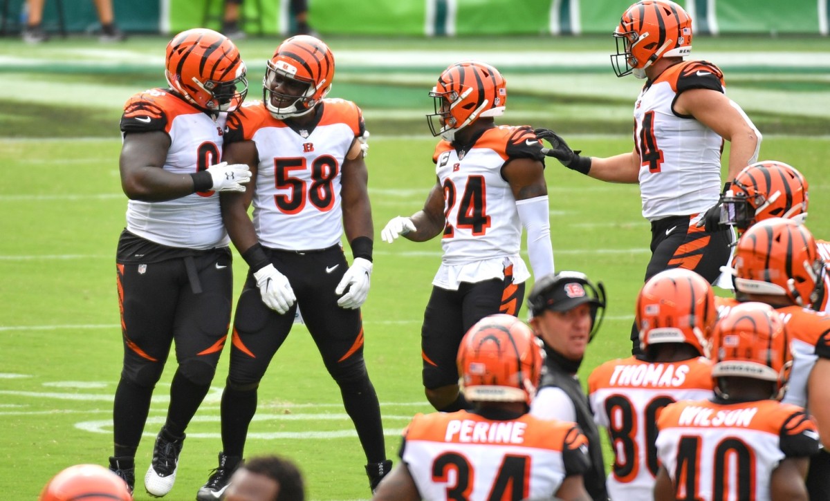 Cincinnati Bengals defensive end Carl Lawson (58) celebrates his sack with nose tackle DJ Reader (98) against the Philadelphia Eagles during the first quarter at Lincoln Financial Field.